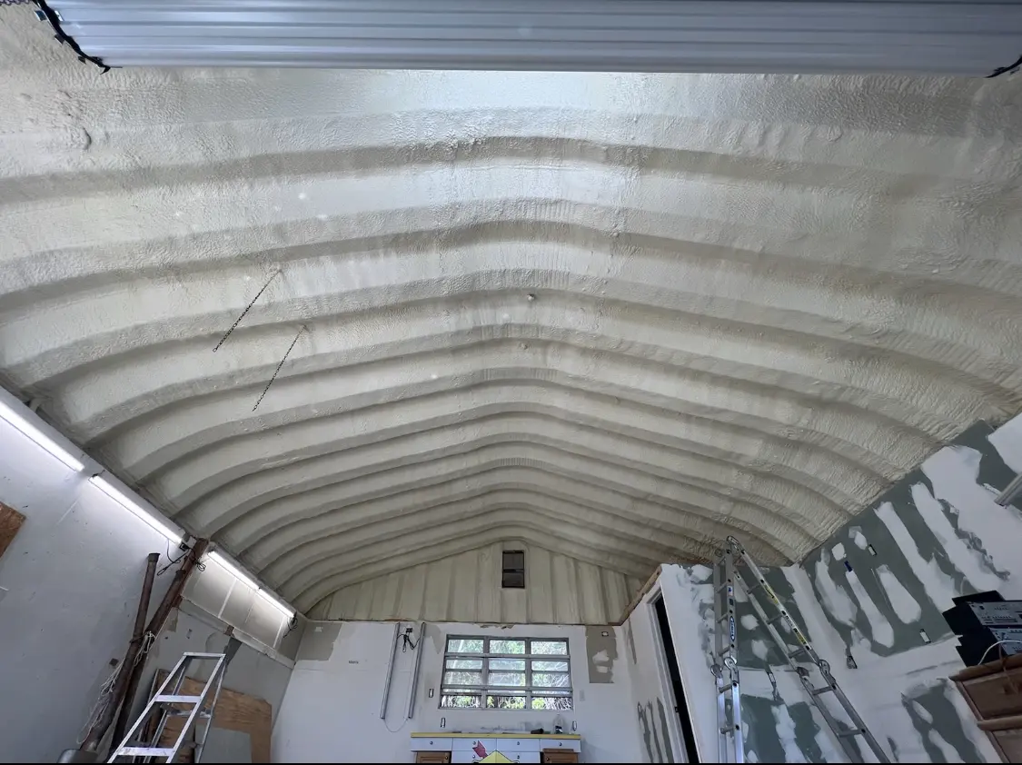 Spray polyurethane foam applied to the underside of a metal roof deck in Swainsboro